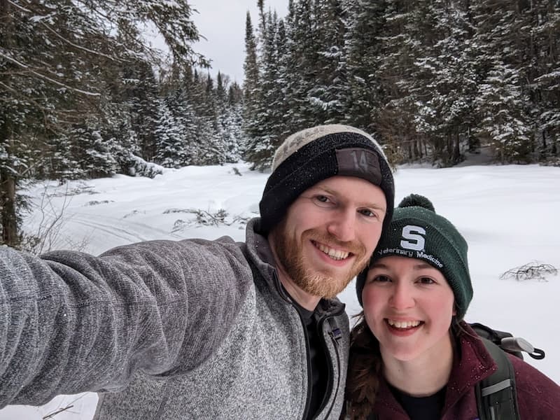 Ainsley and Drew skiing in Algqonquin